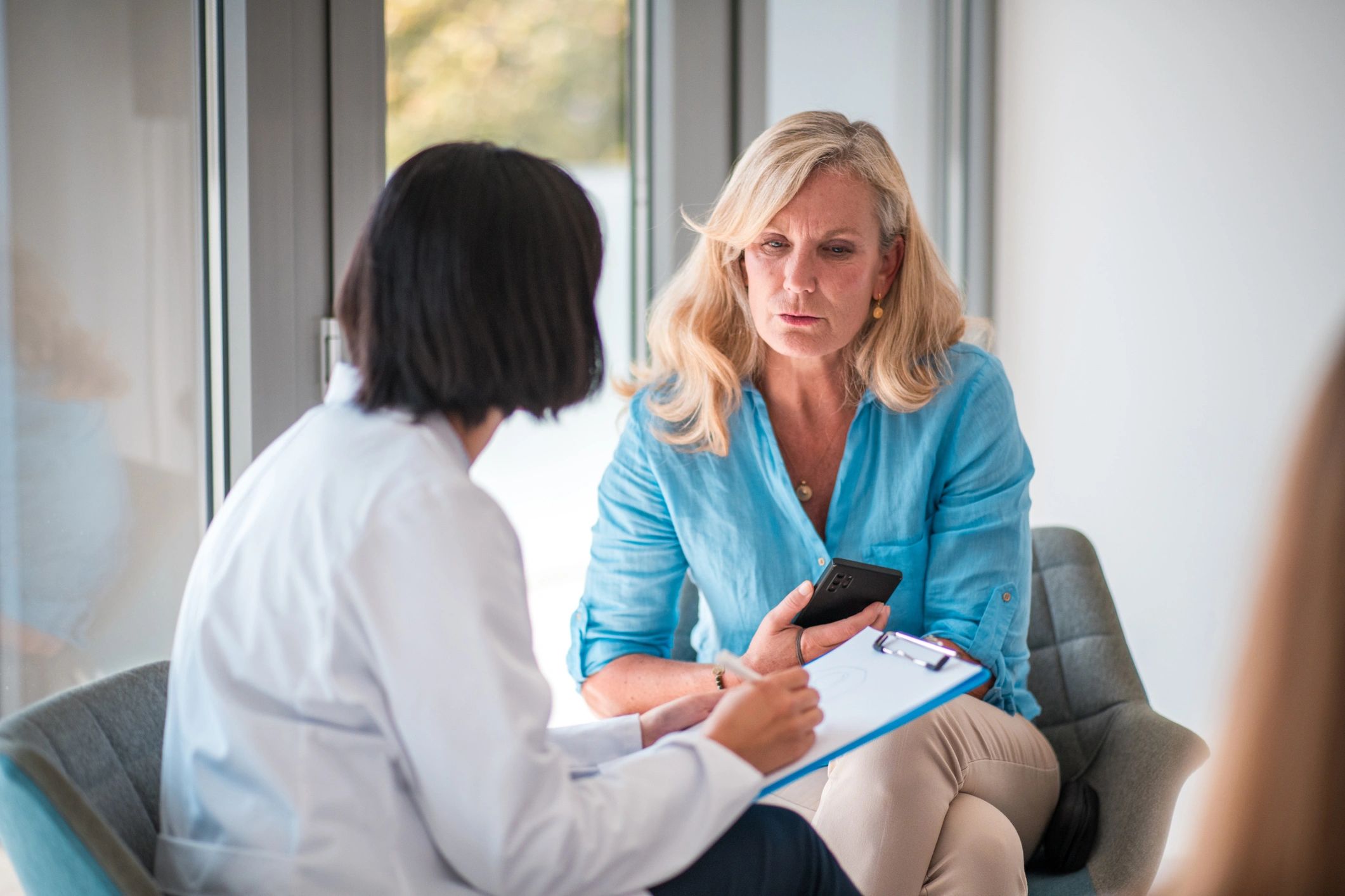 Doctor speaking with patient during healthcare interview