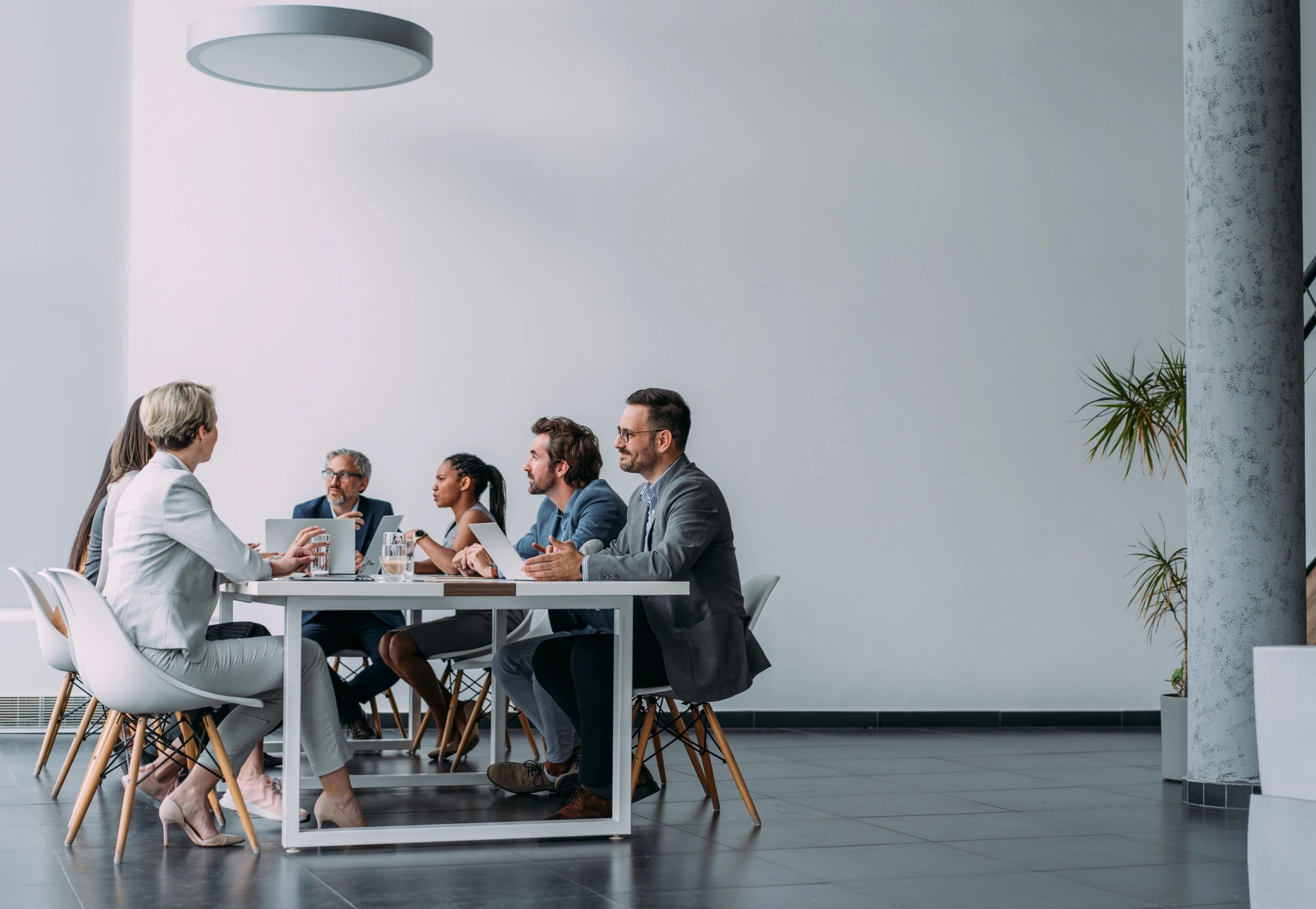 Business team discussing customer and market insights in a meeting