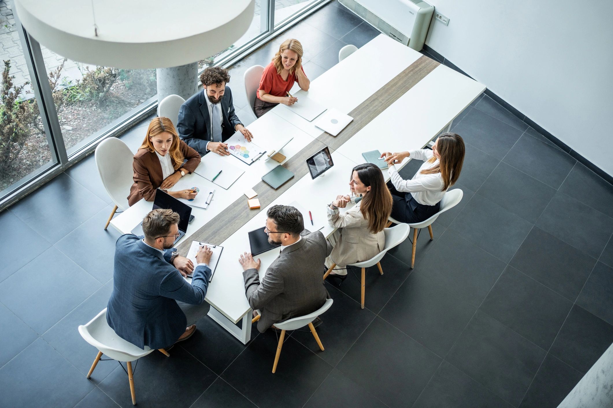 Corporate research team collaborating around a conference table